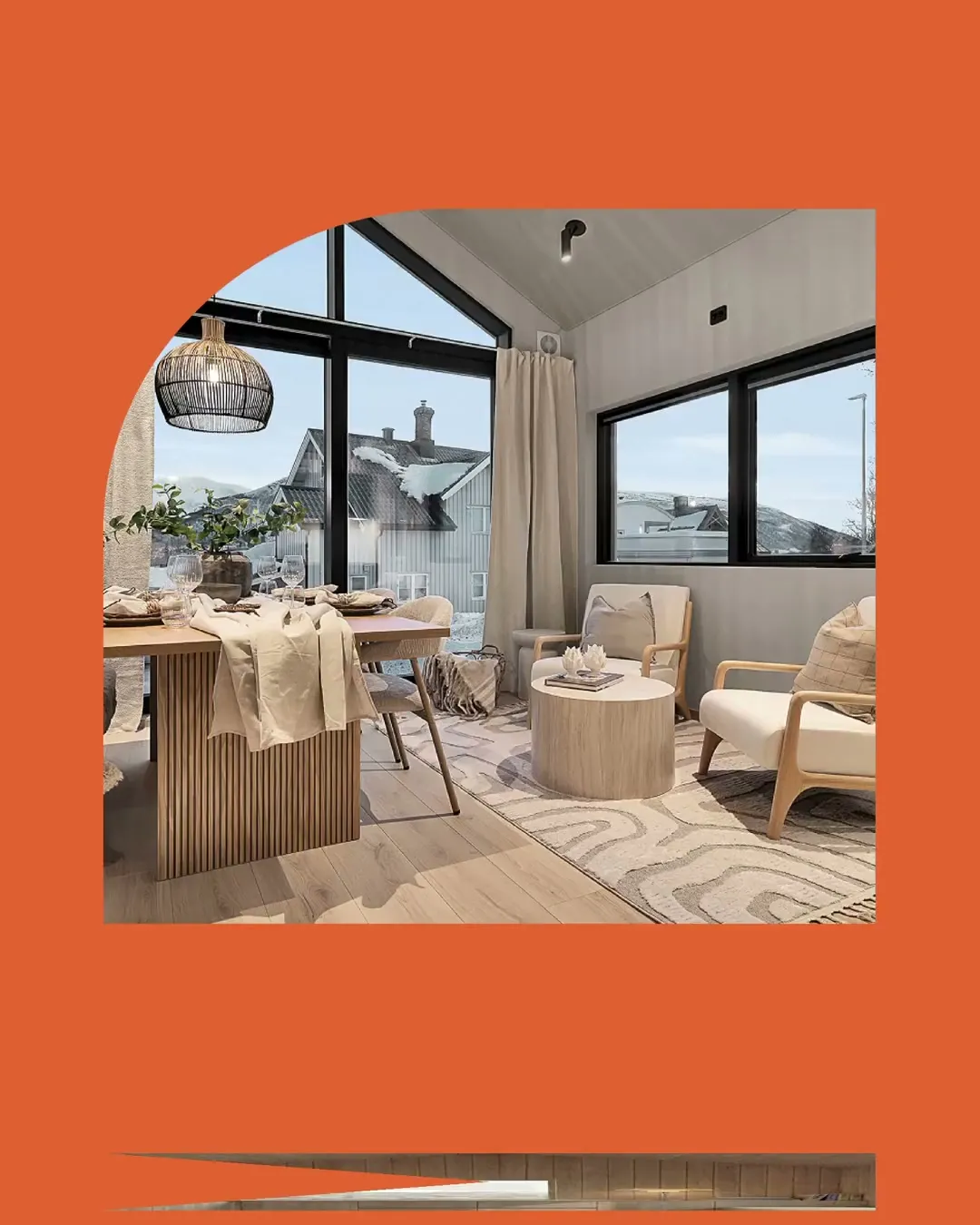 An orange frame with an arched window into a furnished living room